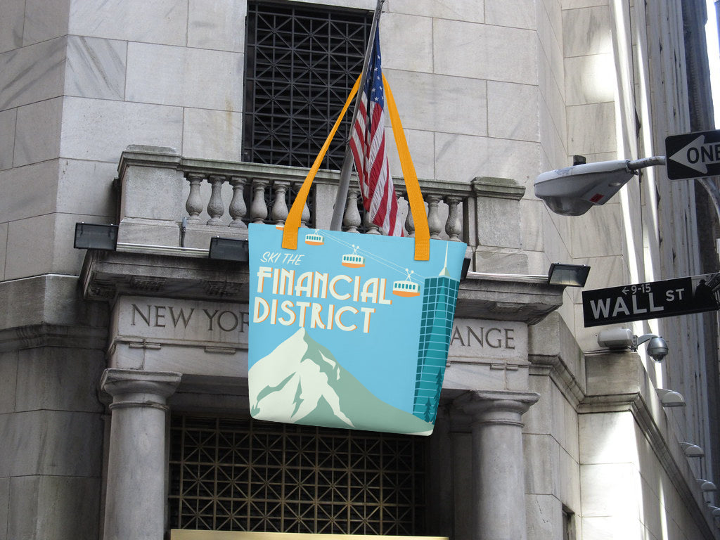 Tote bag with 'Ski the Financial District' text hanging from the New York Stock Exchange in New York City